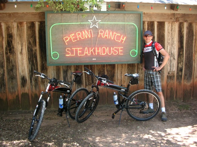 X70 folding bike in front of steak house X70 folding bike in front of steak house