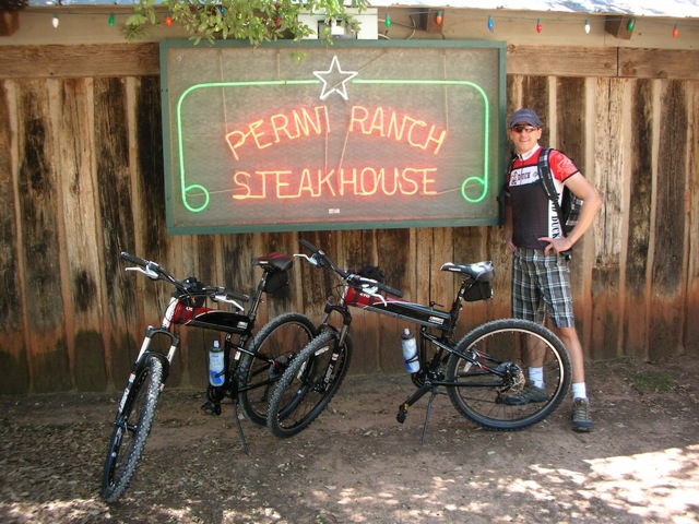 X70 folding bike in front of steak house