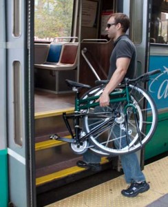 Getting on the subway with a Montague folding bike.
