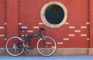 2015 Montague FIT folding bike against brick wall