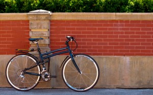 2015 Montague Navigator folding bike against red brick wall