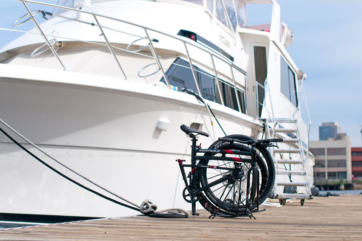 Montague Allston folding bike folded near yacht marina